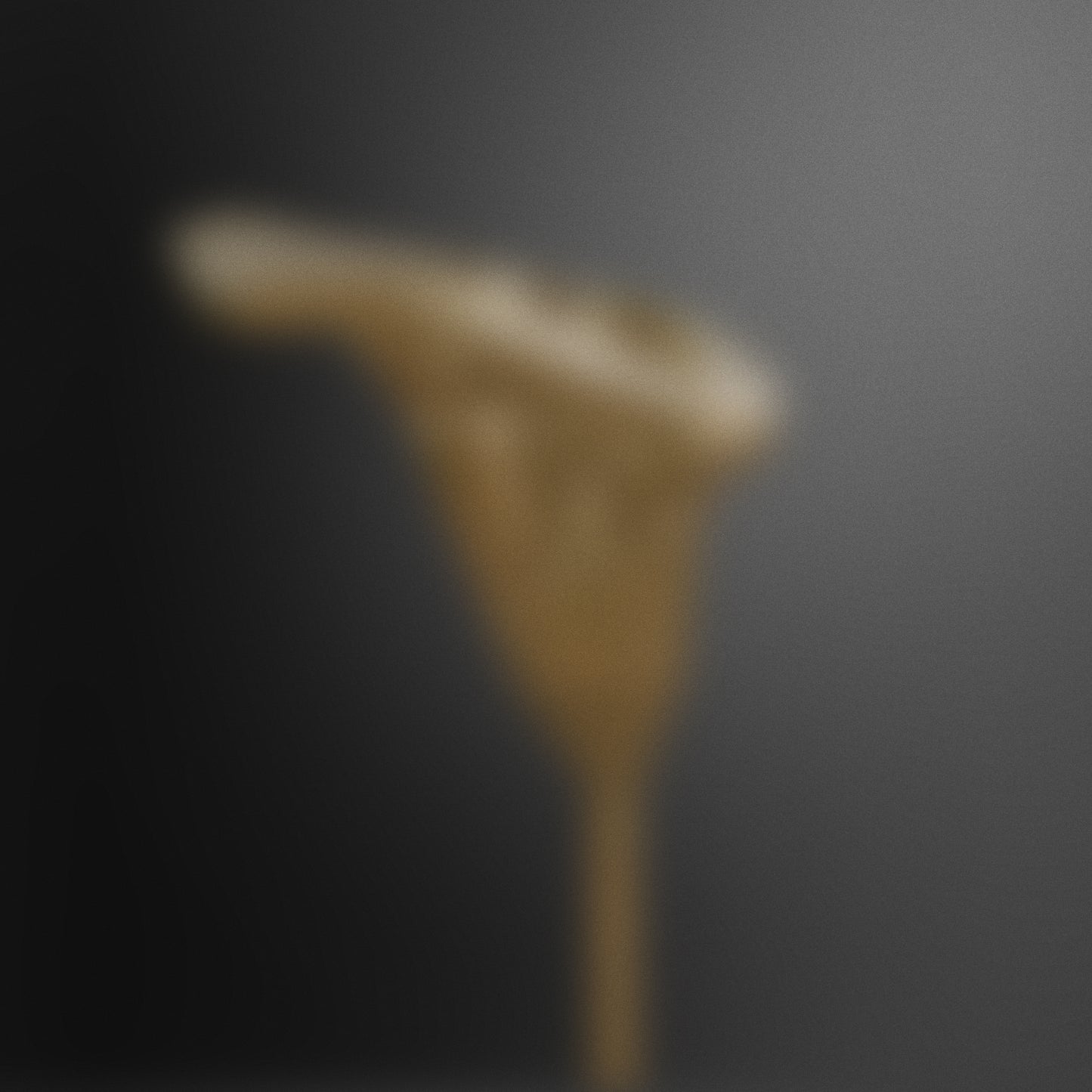 Blurred artistic silhouette of a bronze-toned form set against a soft dark backdrop